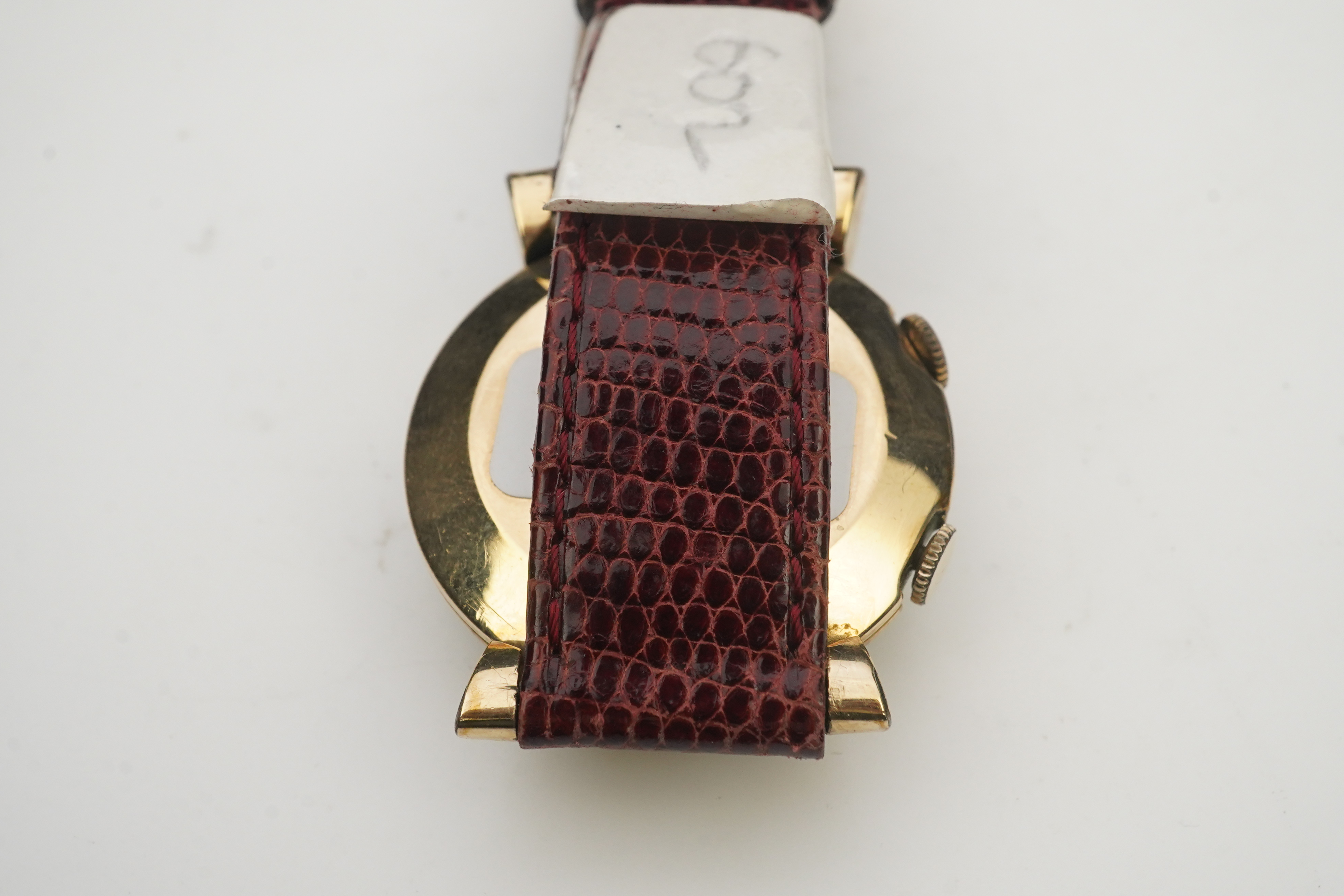 A gentleman's 1950's? 10k gold filled Jaeger LeCoultre Memovox manual wind wrist watch, on a later associated leather strap